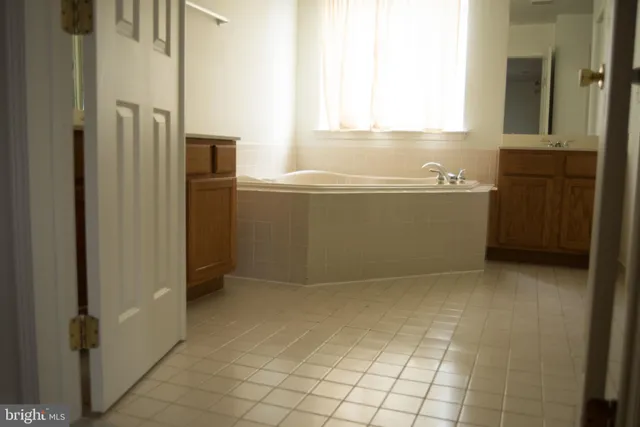 a view of kitchen with cabinets