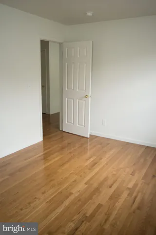 an empty room with wooden floor