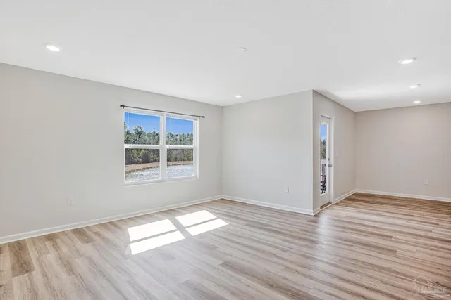 a bathroom with a glass shower door and a toilet