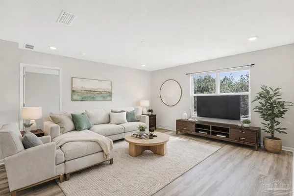 a bathroom with a granite countertop sink and mirror