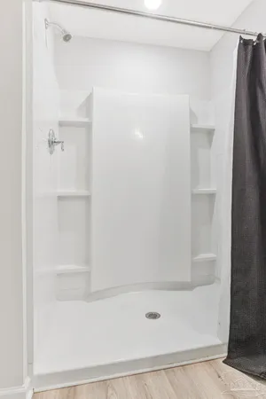 a bathroom with a sink mirror and toilet