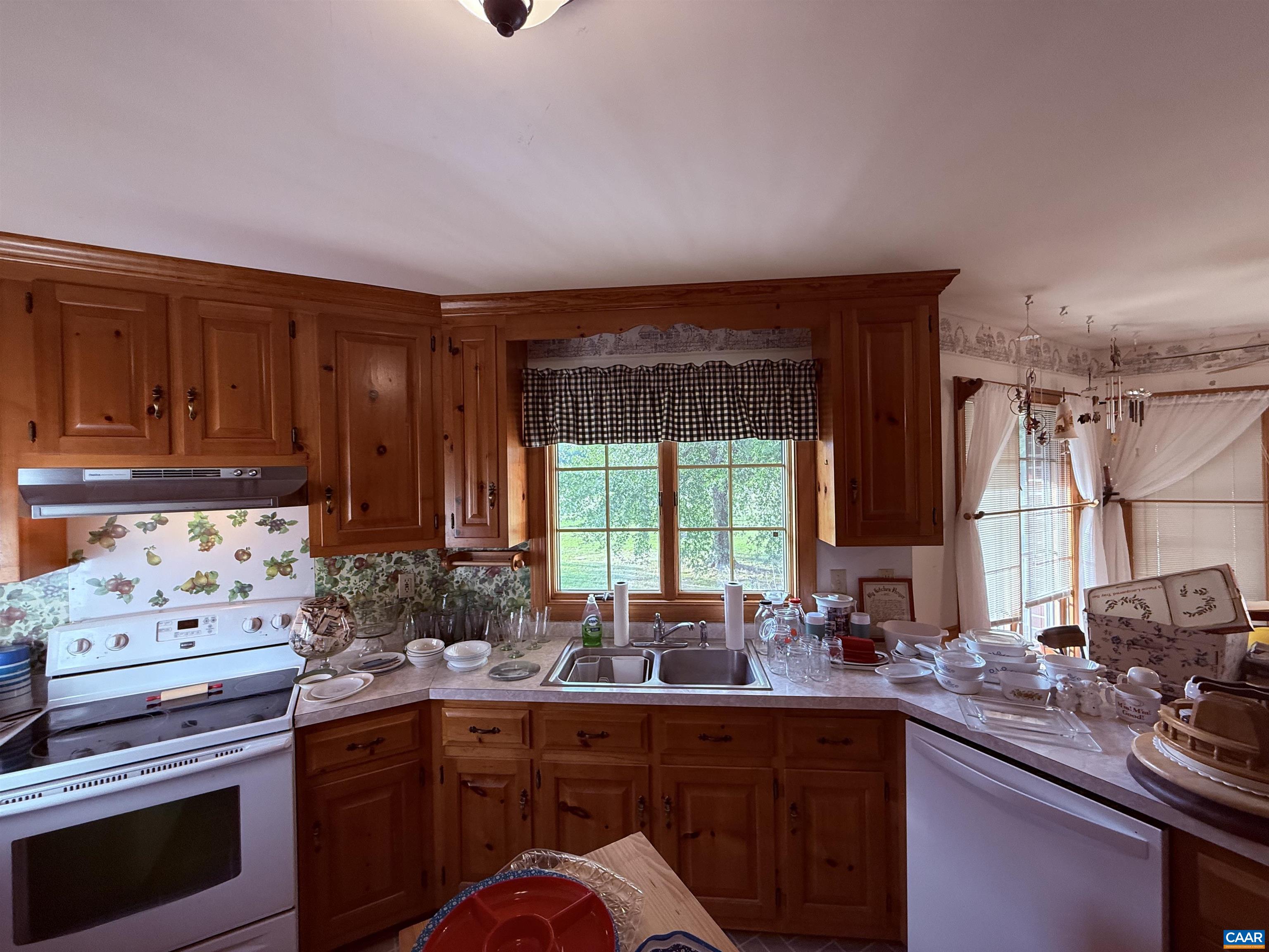5051 Shannon Hill Road Kents Store, VA 23084 - Photo 19 of 67 a kitchen with sink a stove and cabinets