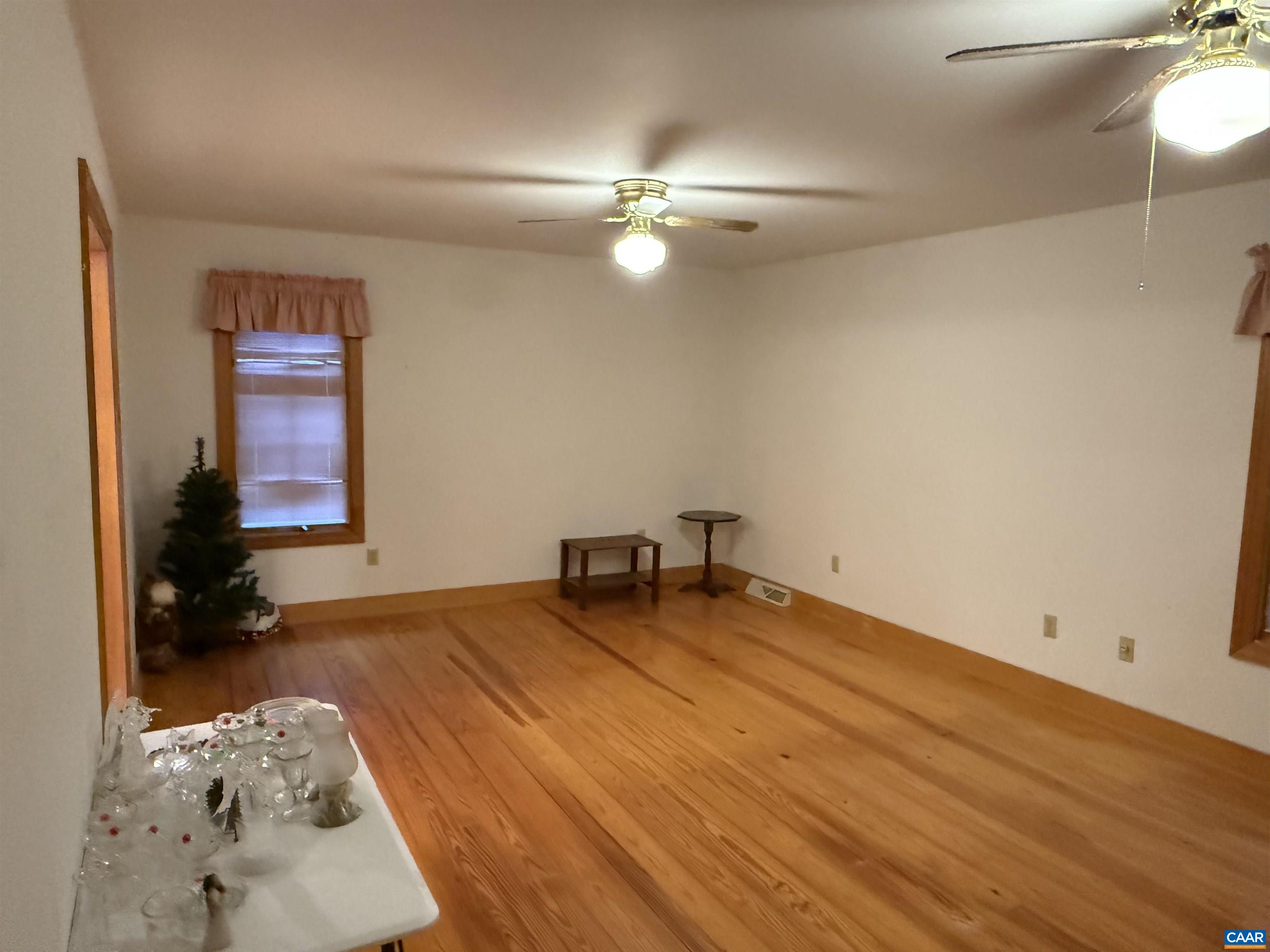 5051 Shannon Hill Road Kents Store, VA 23084 - Photo 26 of 67 wooden floor in an empty room with a window