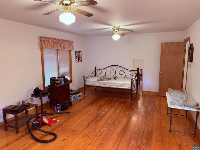 a bathroom with a sink a light fixture and a mirror