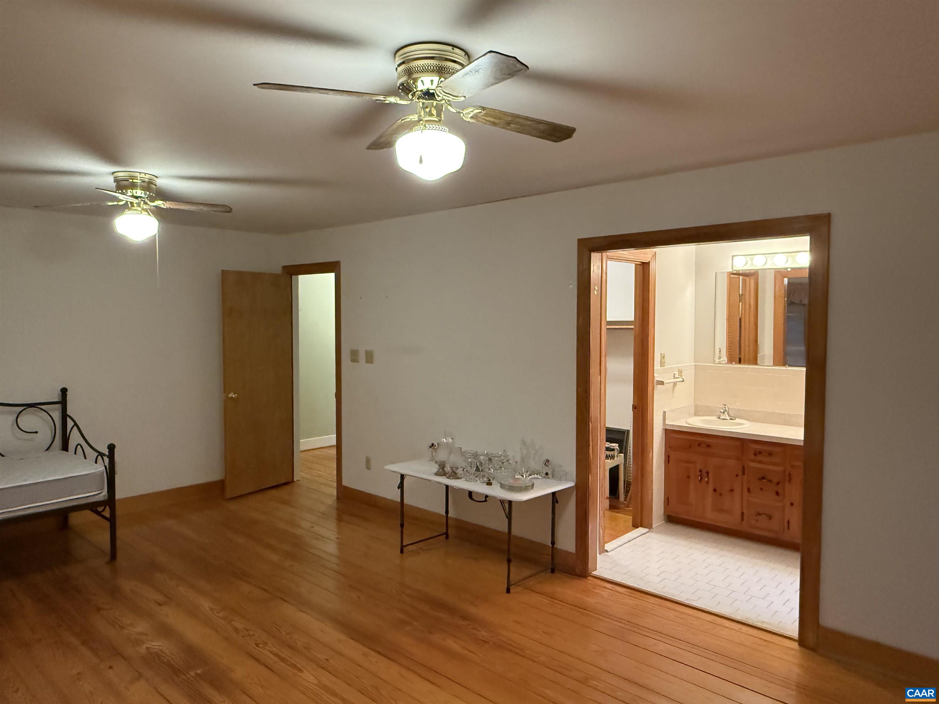 5051 Shannon Hill Road Kents Store, VA 23084 - Photo 29 of 67 wooden floor in an empty room with a window