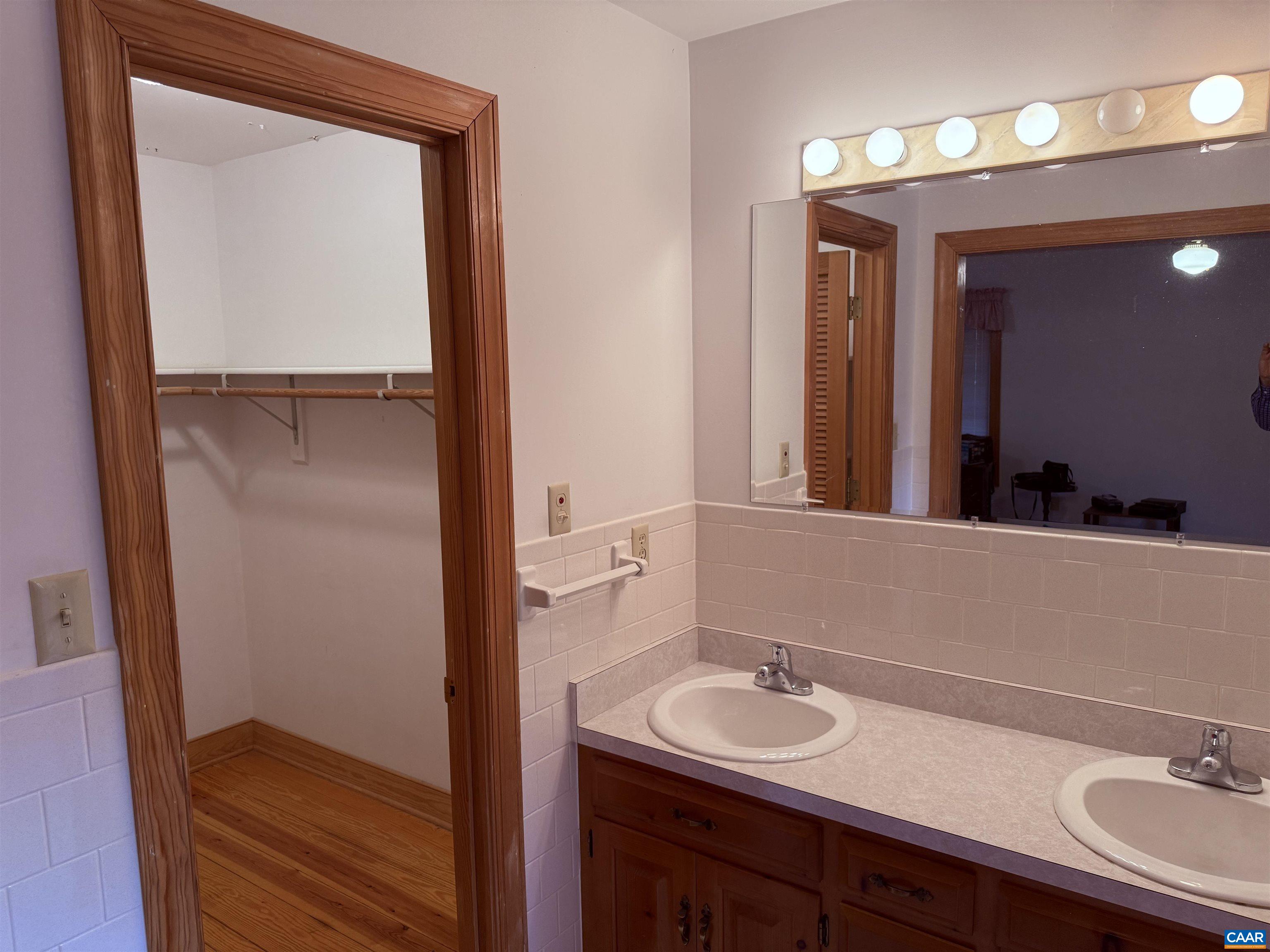 5051 Shannon Hill Road Kents Store, VA 23084 - Photo 31 of 67 a bathroom with a sink and a mirror