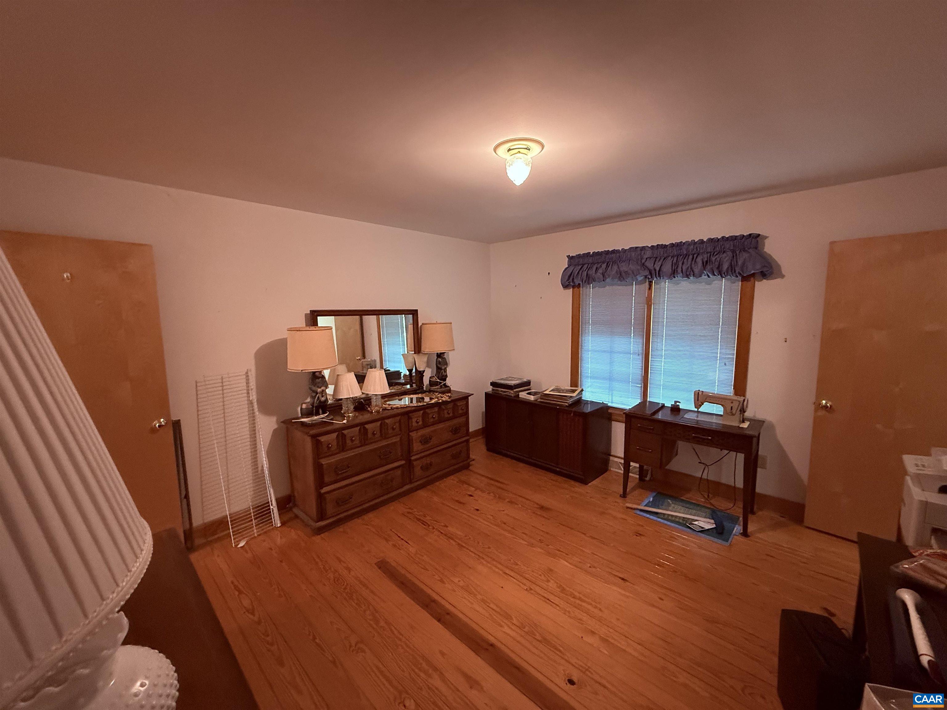 5051 Shannon Hill Road Kents Store, VA 23084 - Photo 39 of 67 a living room with furniture and a wooden floor