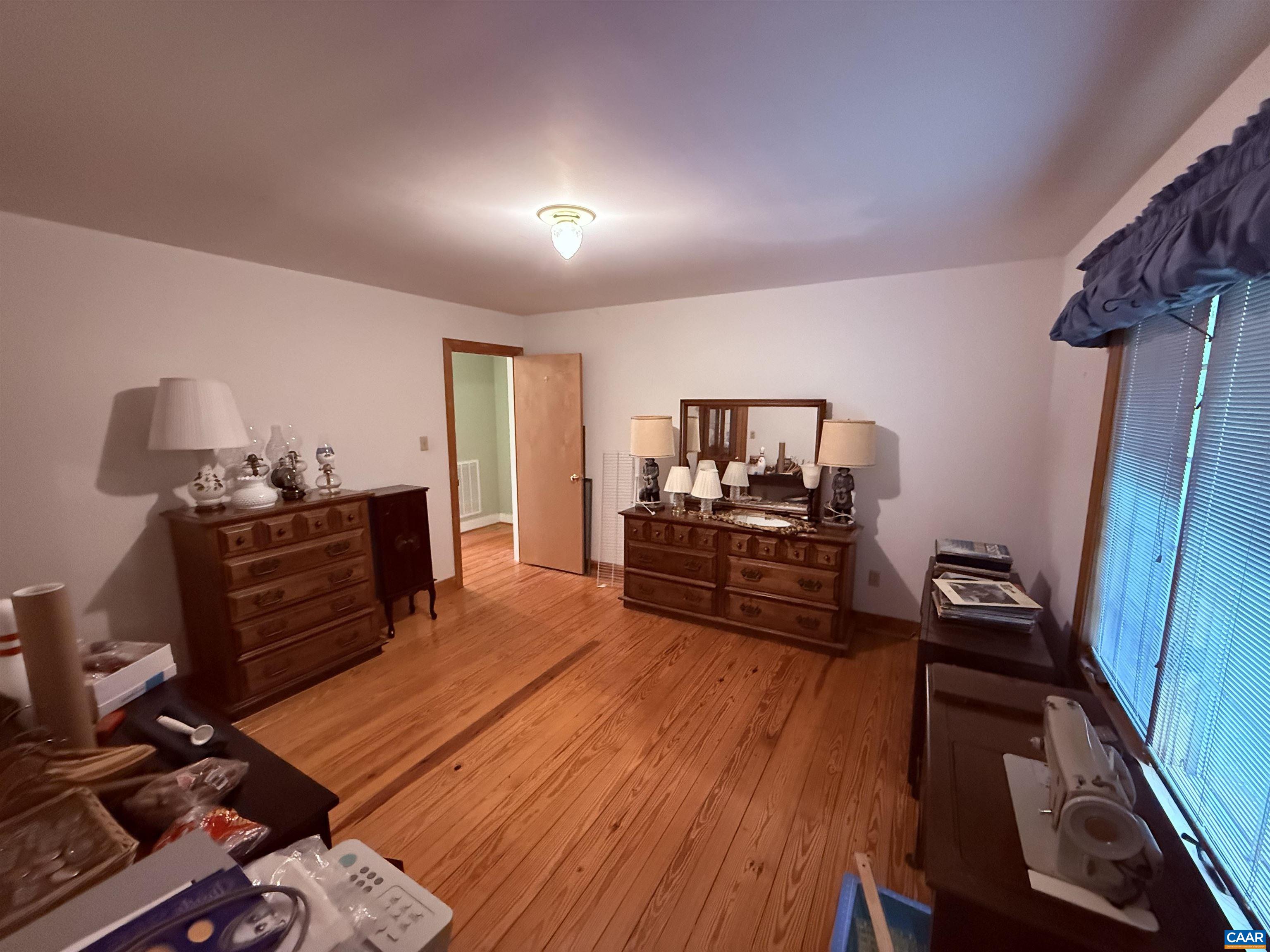 5051 Shannon Hill Road Kents Store, VA 23084 - Photo 40 of 67 a room with furniture and wooden floor