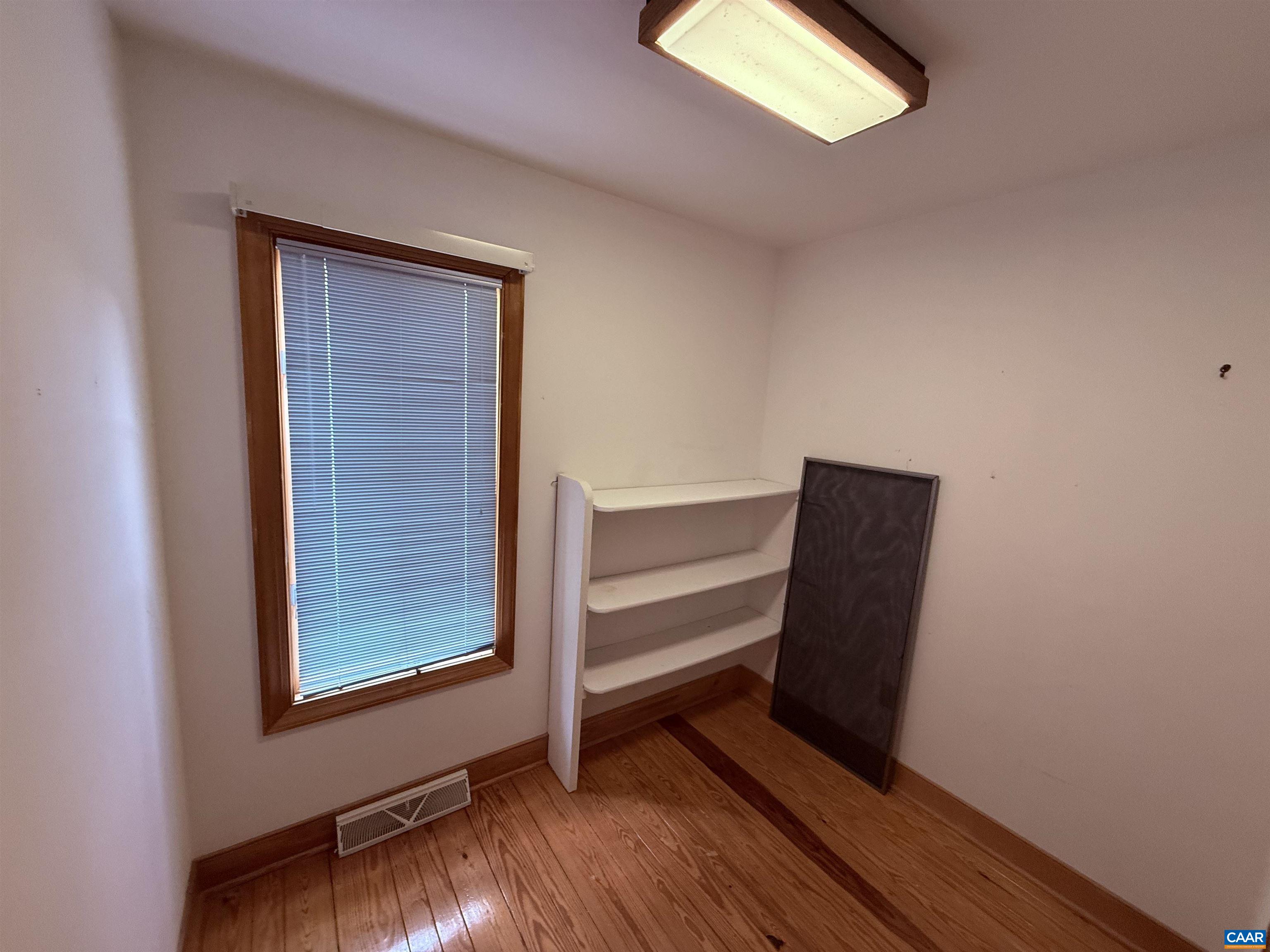 5051 Shannon Hill Road Kents Store, VA 23084 - Photo 42 of 67 a view of an empty room with wooden floor and a window
