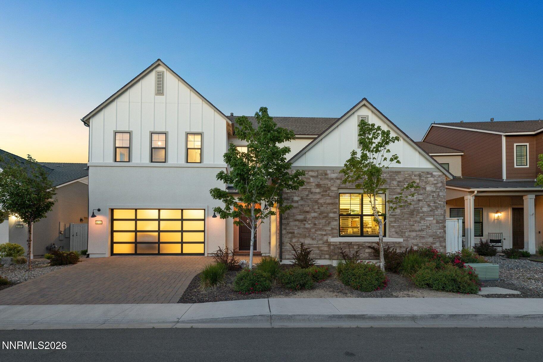 6110 South Pleasant Oak Trail Reno, NV 89511 - Photo 1 of 66 a front view of a house with garden