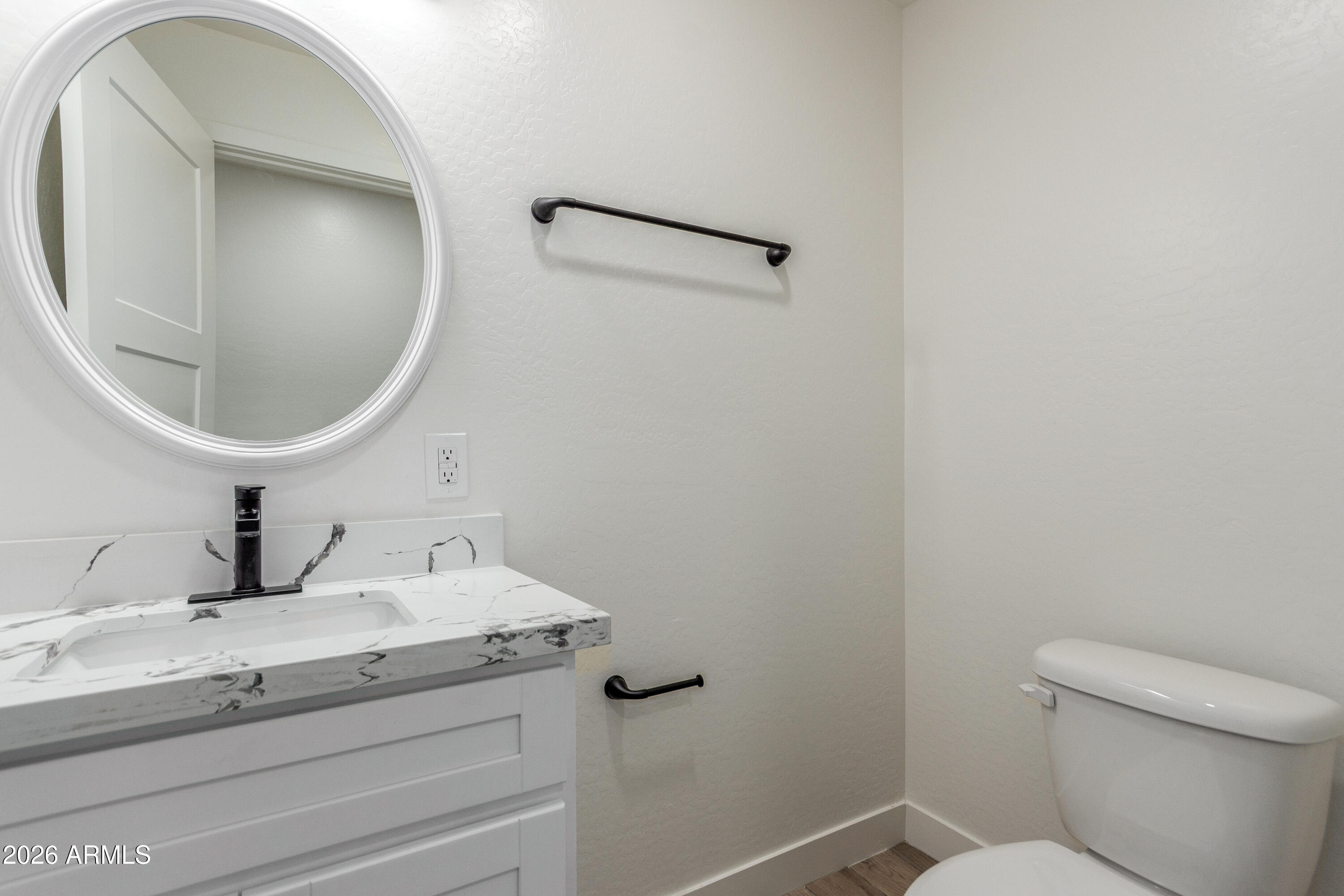 16632 North 18th Place Phoenix, AZ 85022 - Photo 17 of 28 a bathroom with a sink and mirror