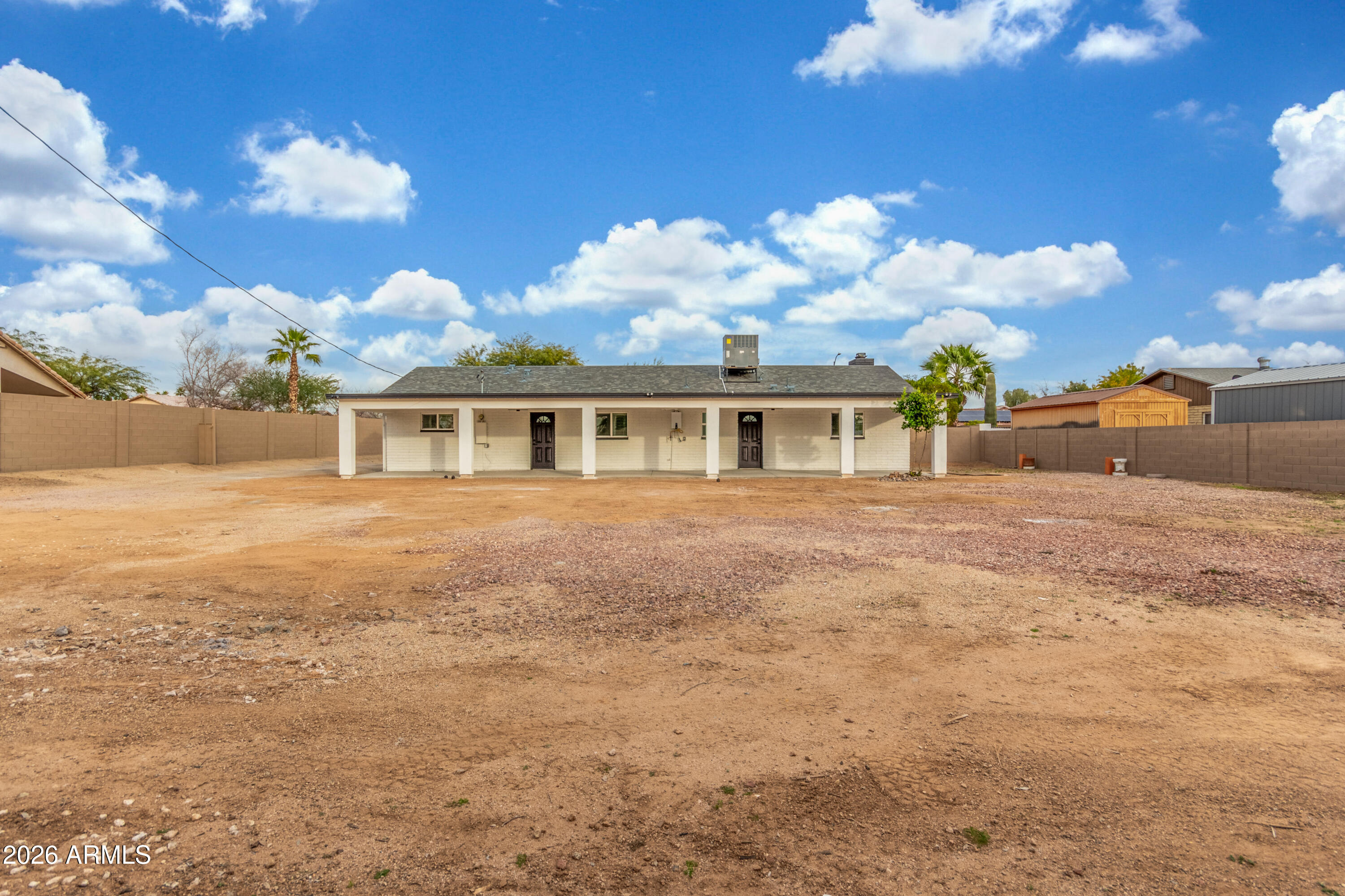 16632 North 18th Place Phoenix, AZ 85022 - Photo 25 of 28 a backyard of a house with table and chairs