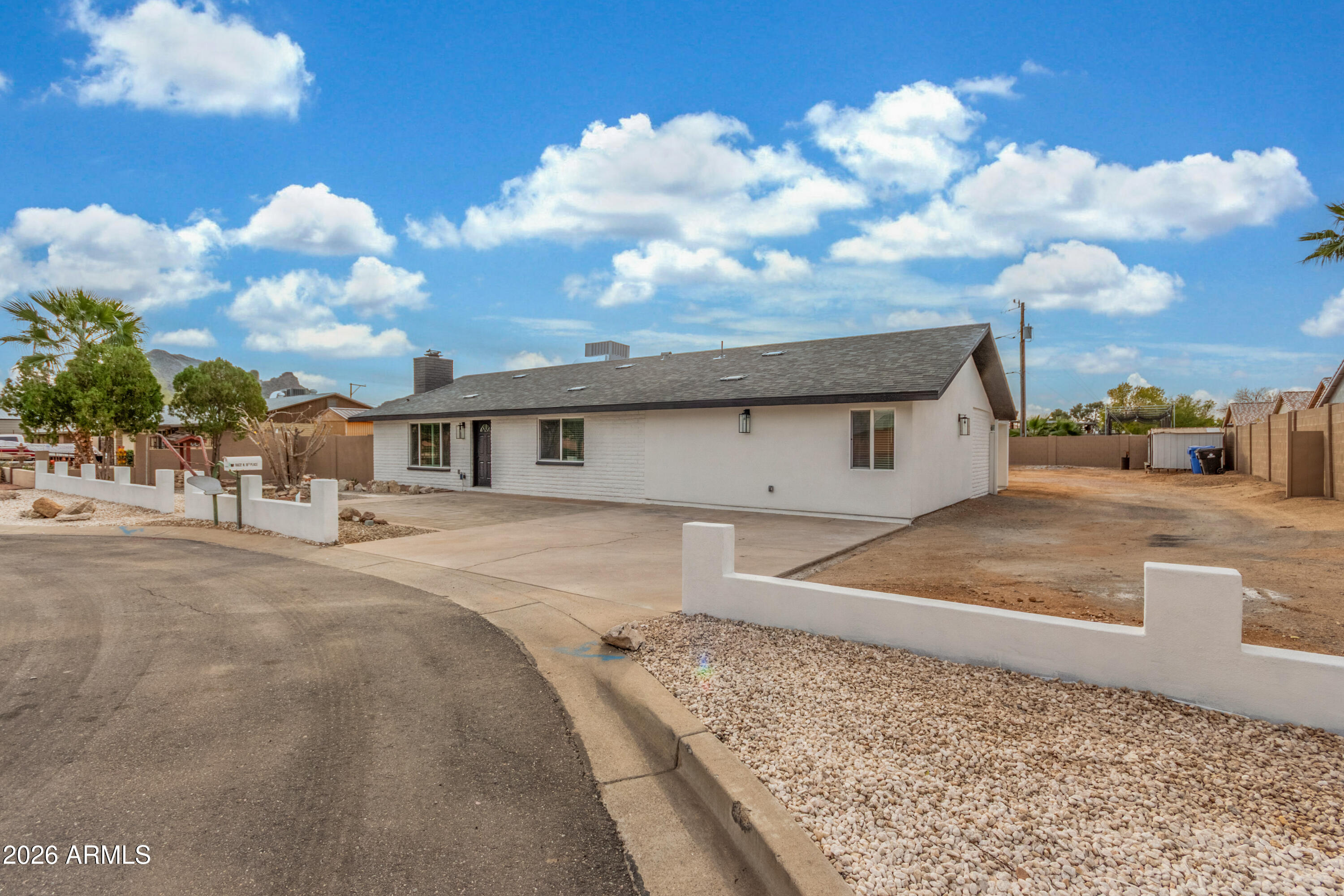 16632 North 18th Place Phoenix, AZ 85022 - Photo 5 of 28 a front view of a house with a yard