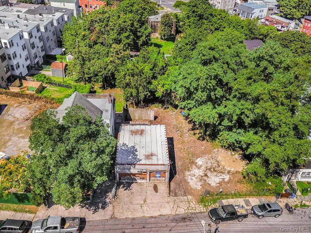 an aerial view of a house with a yard