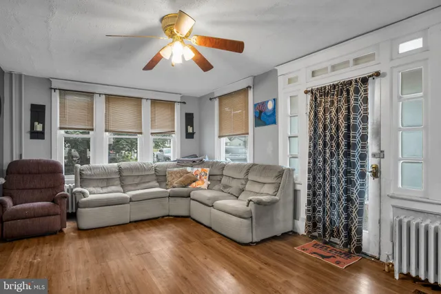 a living room with furniture and a large window