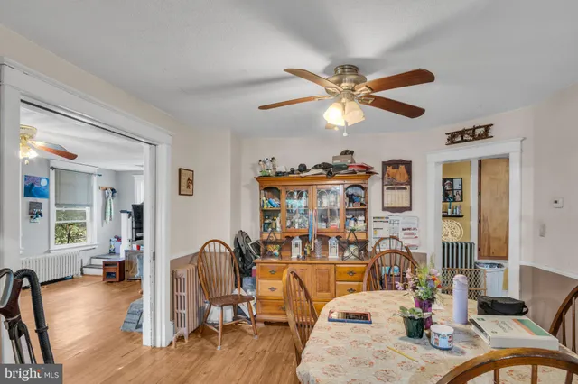 a living room with fireplace furniture and a wooden floor
