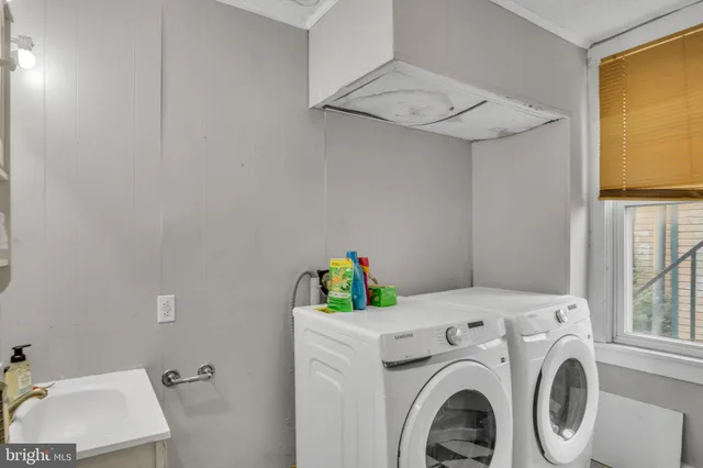 a utility room with dryer and washer