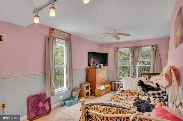 a bedroom with furniture a bed and a window