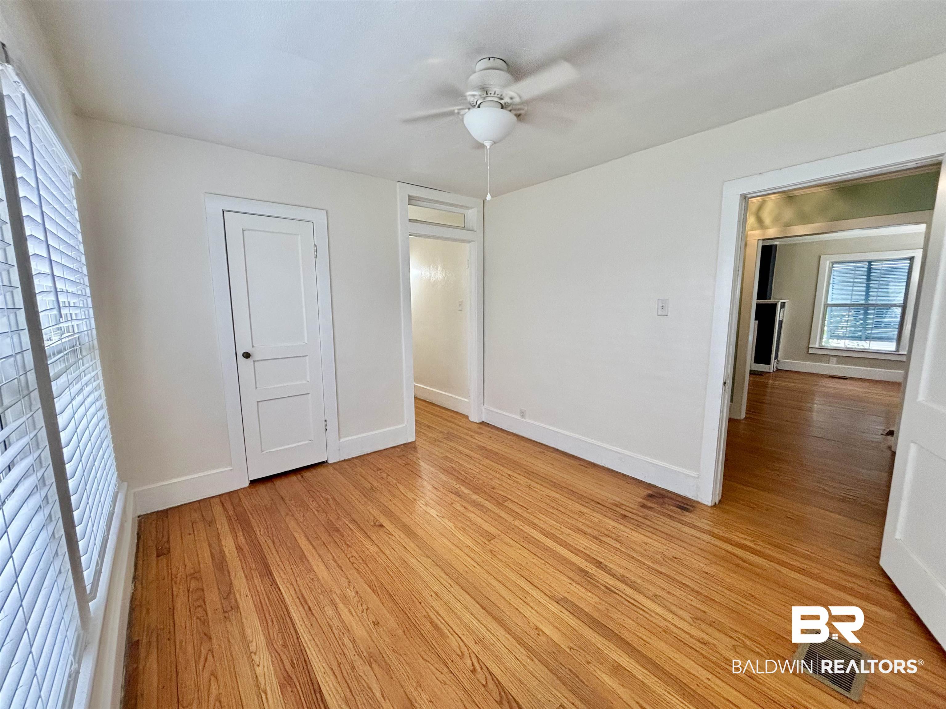 114 Crenshaw Street Mobile, AL 36606 - Photo 29 of 49 Unfurnished bedroom with a ceiling fan, baseboards, visible vents, and light wood finished floors