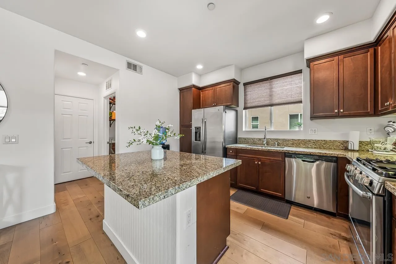 2710 Sparta Road, Unit 1 Chula Vista, CA 91915 - Photo 16 of 45 a kitchen with stainless steel appliances granite countertop a sink stove and refrigerator