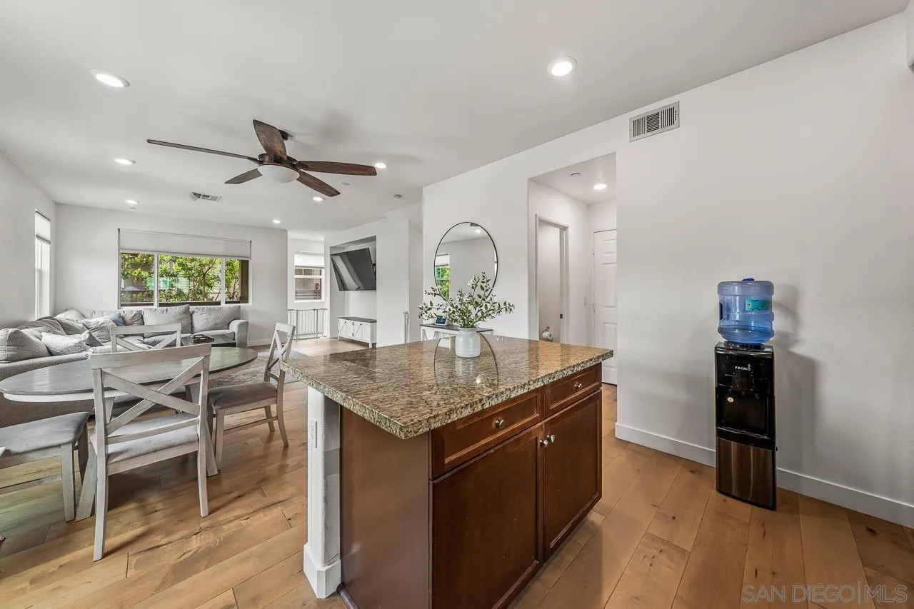 2710 Sparta Road, Unit 1 Chula Vista, CA 91915 - Photo 17 of 45 a kitchen with center island table and chairs in it