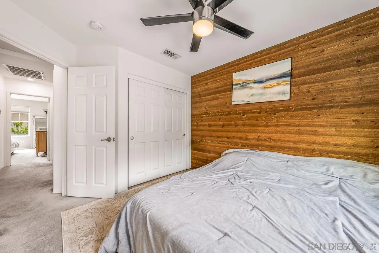 2710 Sparta Road, Unit 1 Chula Vista, CA 91915 - Photo 26 of 45 a bedroom with a bed and a ceiling fan
