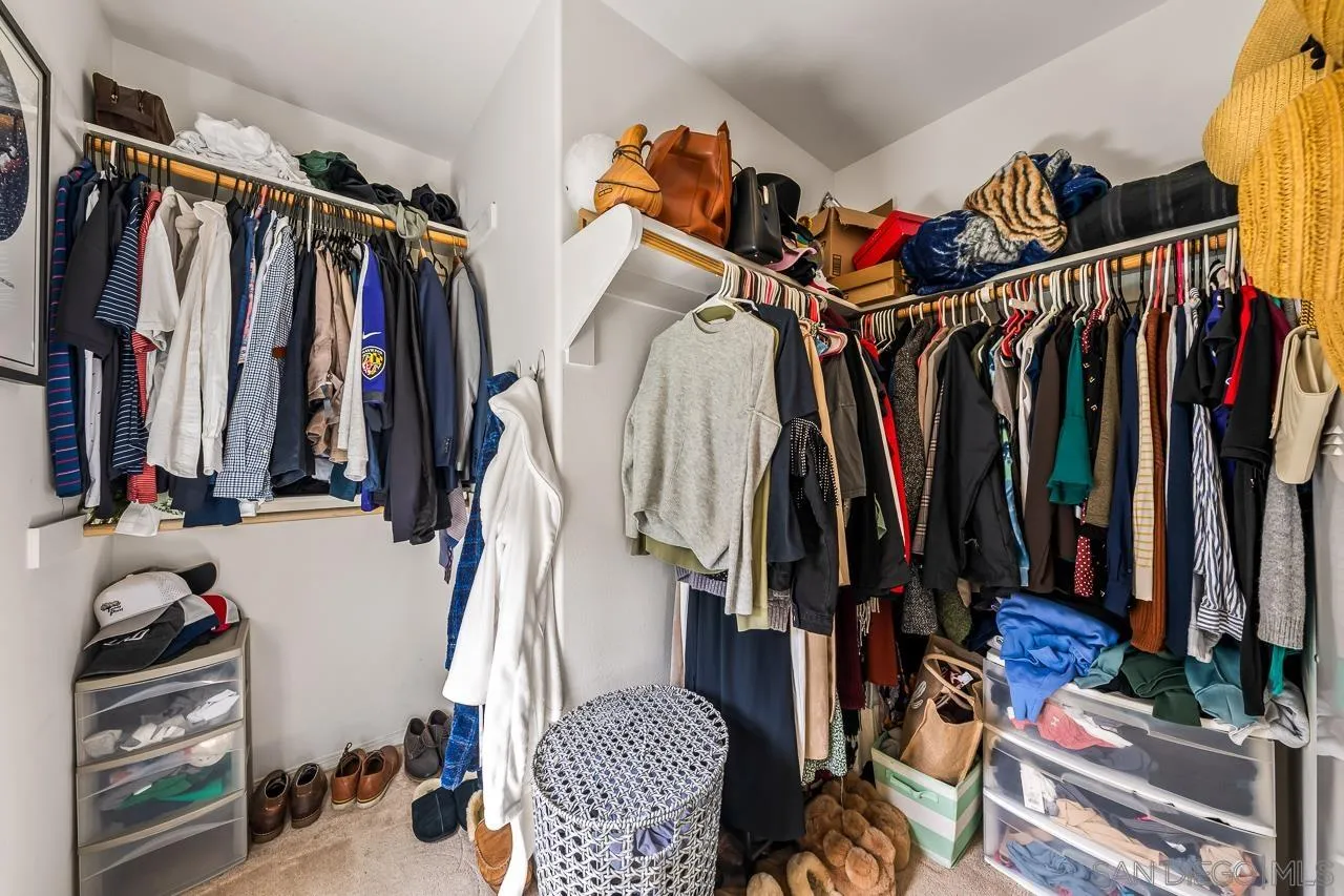 2710 Sparta Road, Unit 1 Chula Vista, CA 91915 - Photo 32 of 45 a view of walk in closet with clothes and shoes