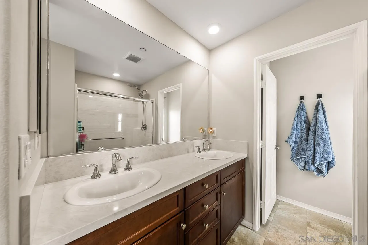 2710 Sparta Road, Unit 1 Chula Vista, CA 91915 - Photo 33 of 45 a bathroom with double vanity sinks and a mirror
