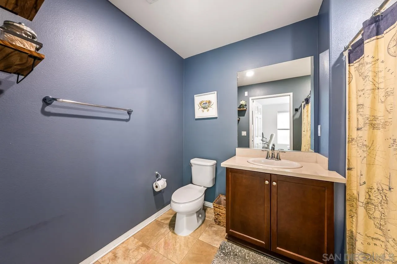 2710 Sparta Road, Unit 1 Chula Vista, CA 91915 - Photo 37 of 45 a bathroom with a toilet a sink and mirror