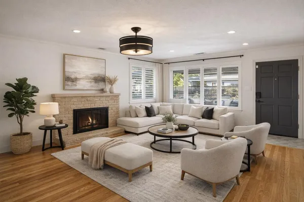 a living room with furniture and a fireplace