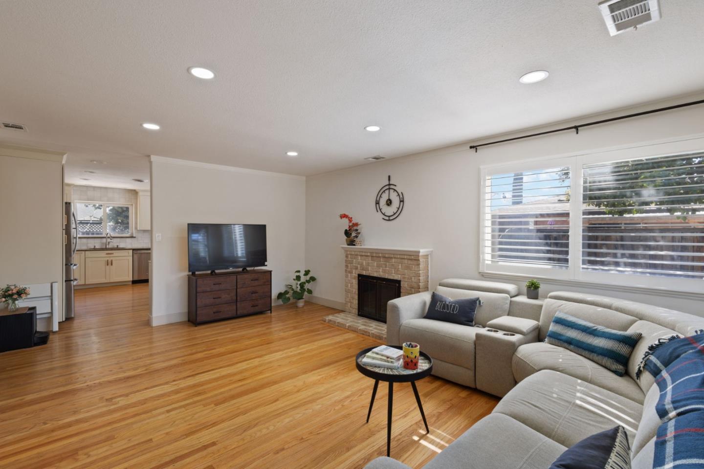 3959 Purdue Way Livermore, CA 94550 - Photo 6 of 19 a living room with furniture a flat screen tv and a fireplace