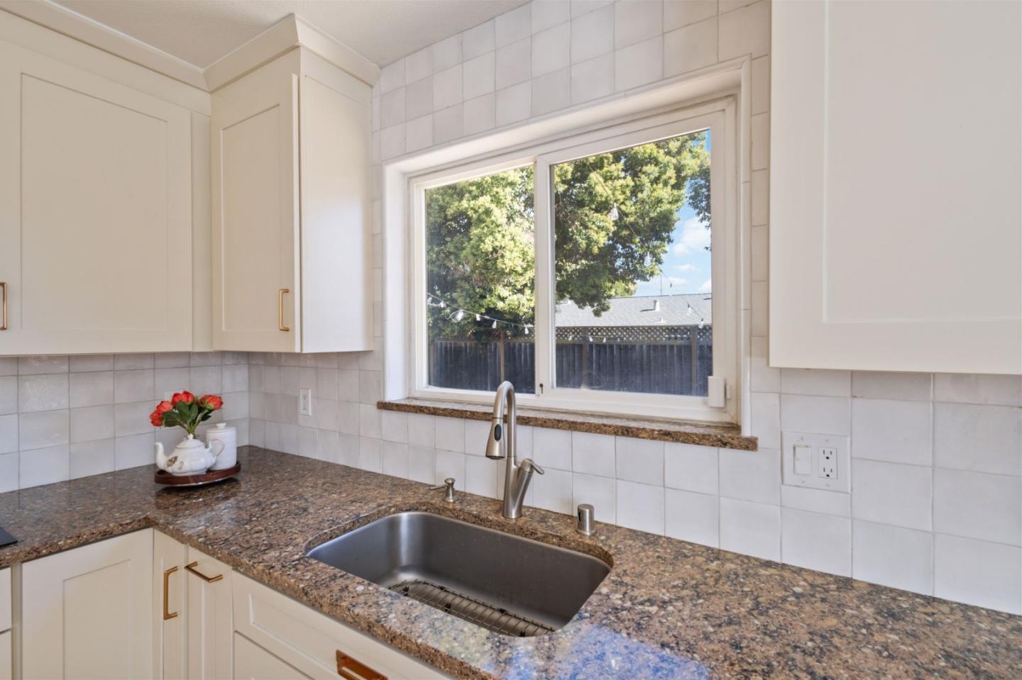 3959 Purdue Way Livermore, CA 94550 - Photo 9 of 19 a kitchen with granite countertop a sink and a window