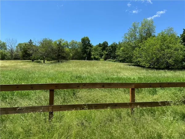 a view of a lake with a big yard
