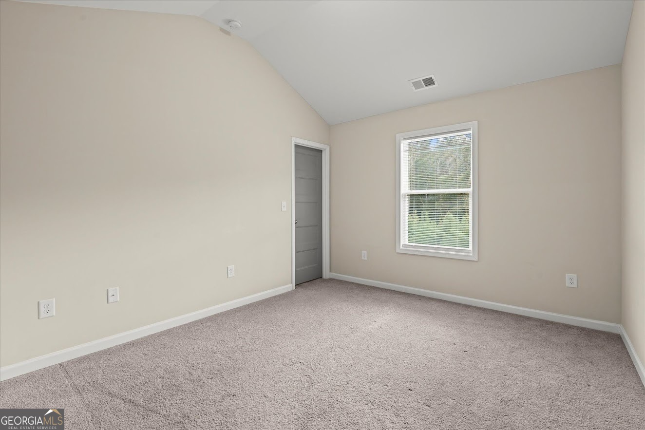 125 Springwood Drive Carrollton, GA 30117 - Photo 26 of 48 an empty room with windows