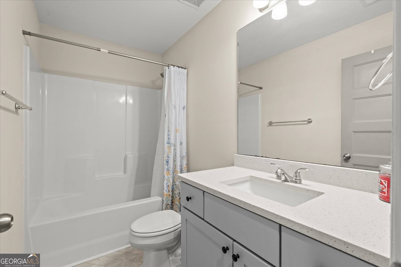 125 Springwood Drive Carrollton, GA 30117 - Photo 29 of 48 a bathroom with a sink toilet and shower