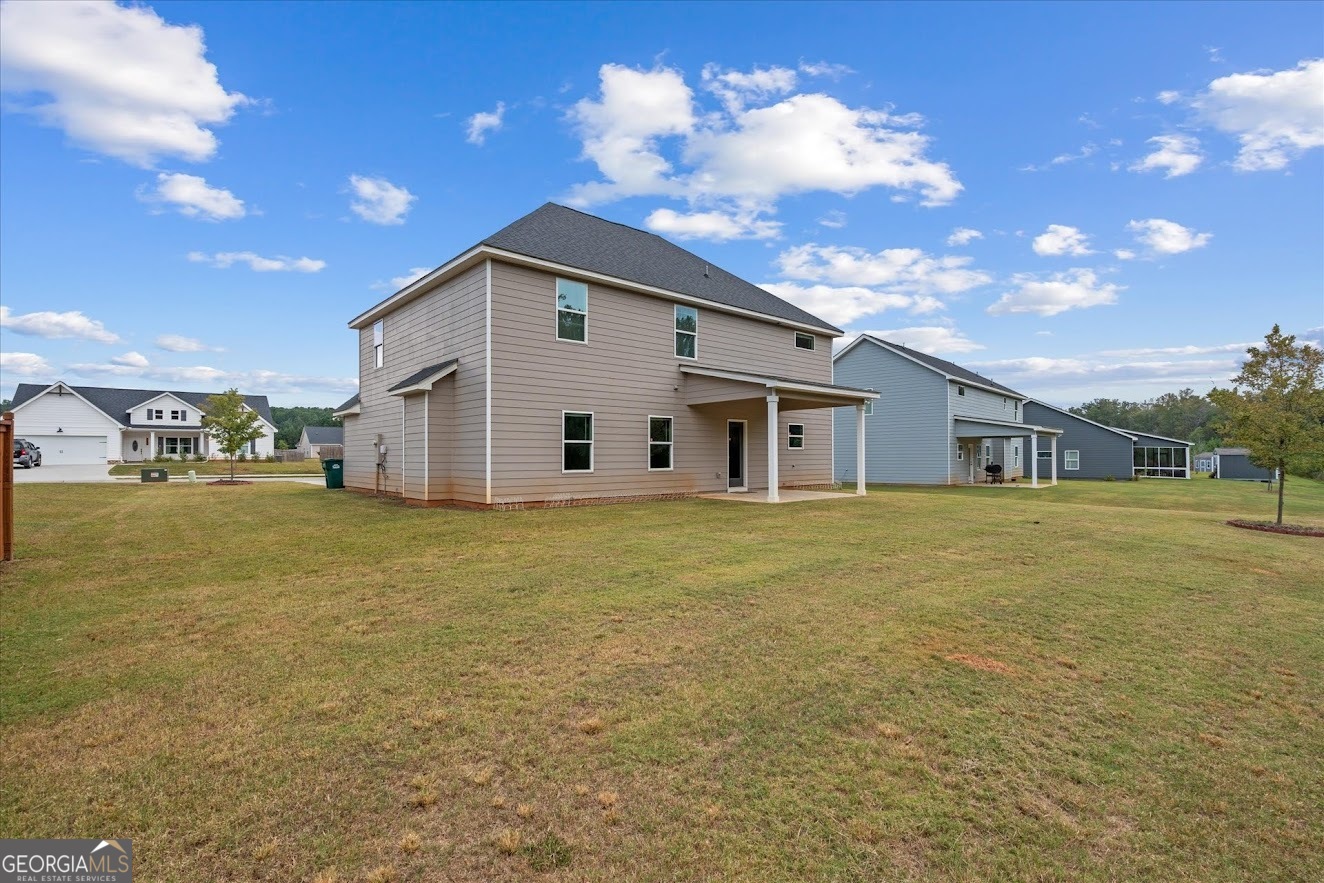 125 Springwood Drive Carrollton, GA 30117 - Photo 31 of 48 a view of a house with a backyard