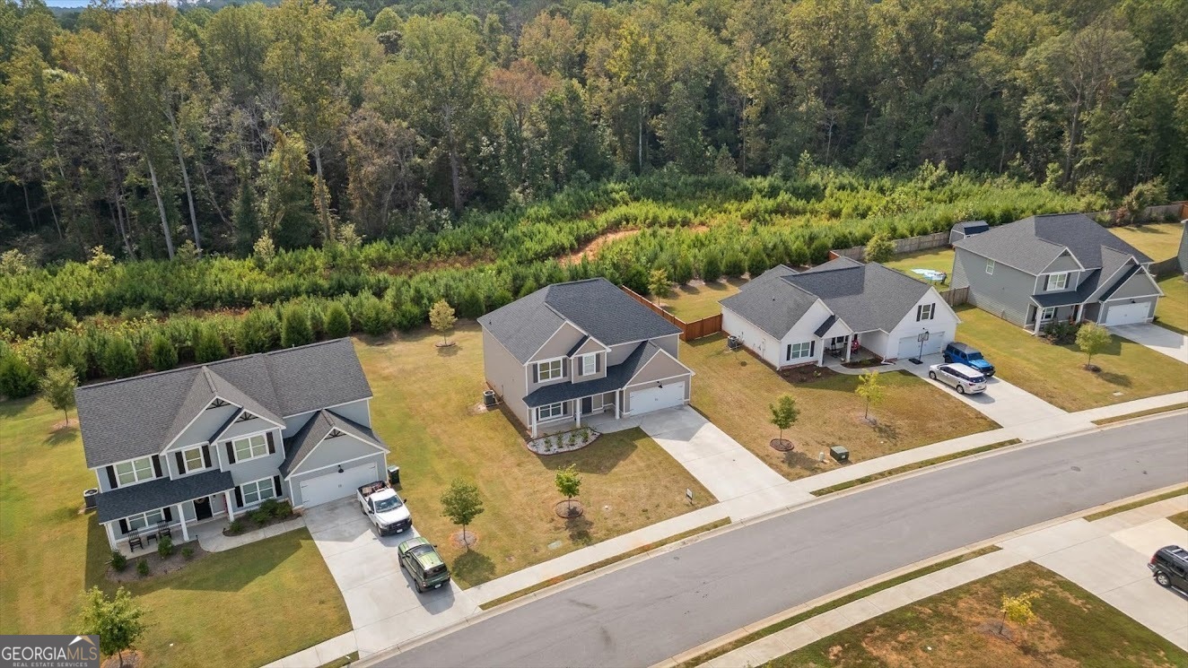 125 Springwood Drive Carrollton, GA 30117 - Photo 45 of 48 an aerial view of a house with swimming pool and lake view
