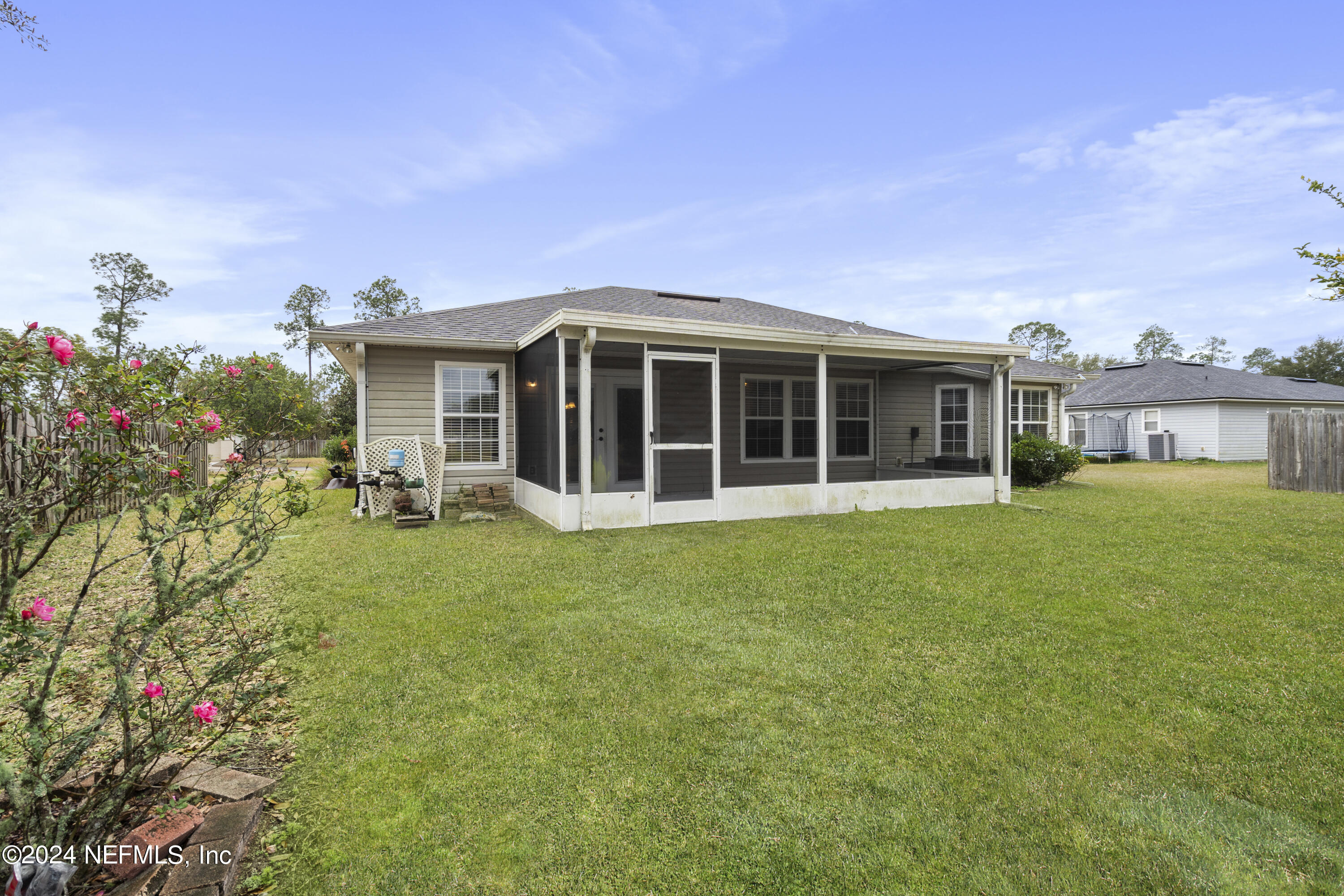 86701 Cartesian Pointe Drive Yulee, FL 32097 - Photo 36 of 36 a view of a house with a garden