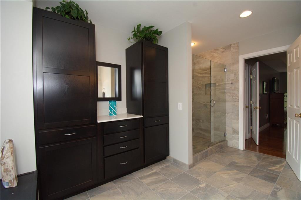425 Rolling Hills Road Freedom, PA 15042 - Photo 13 of 25 Custom tile work graces the owner's suite and features a spacious stand up tile shower.