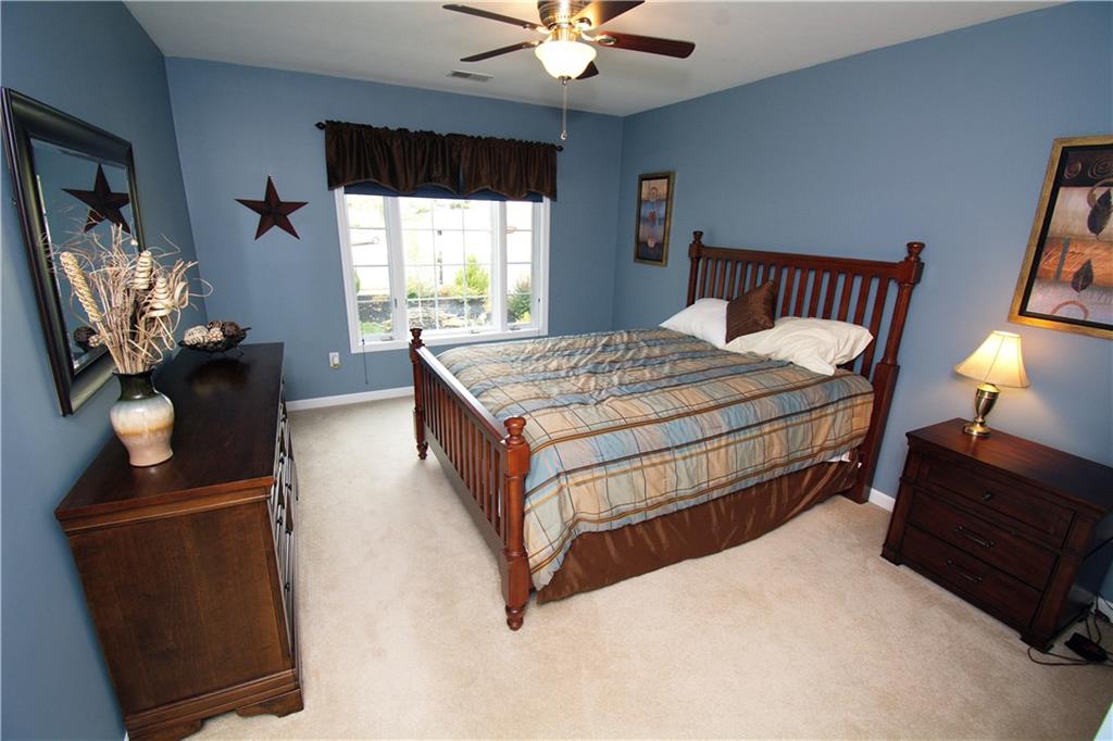 425 Rolling Hills Road Freedom, PA 15042 - Photo 14 of 25 The second level features a roomy guest bedroom with a bright window, neutral plush carpet and private access to the hall bath.