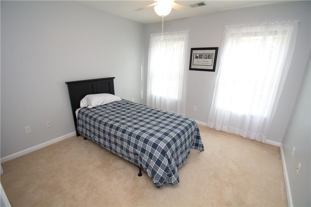 425 Rolling Hills Road Freedom, PA 15042 - Photo 16 of 25 Another guest bedroom is bright and features generous storage.