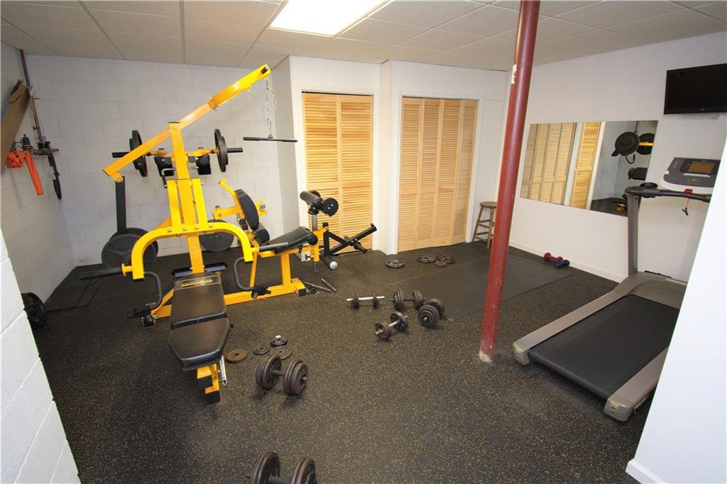 425 Rolling Hills Road Freedom, PA 15042 - Photo 18 of 25 The finished lower level features a spacious exercise room with rubber flooring and ample storage.