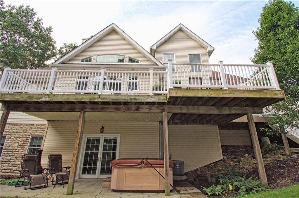 425 Rolling Hills Road Freedom, PA 15042 - Photo 23 of 25 The back of the home provides various outdoor entertaining areas. The expansive top deck is accessible from three points of the home. The lower level patio is accessible from the finished lower level.