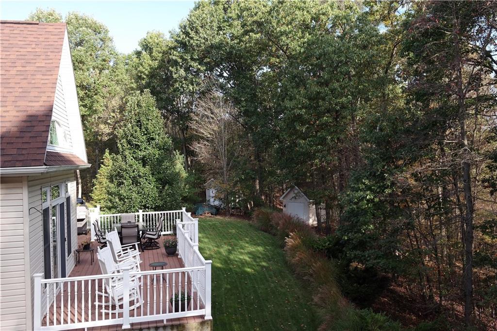425 Rolling Hills Road Freedom, PA 15042 - Photo 25 of 25 The mature tree lined back yard and various entertaining areas compliment this stunning custom home.