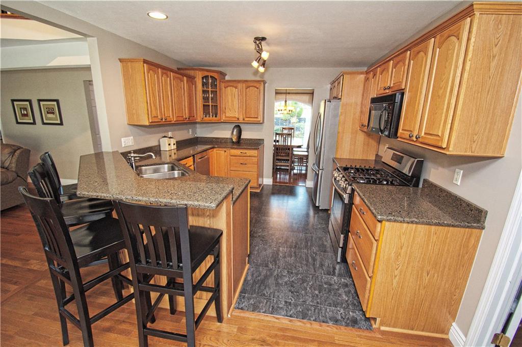 425 Rolling Hills Road Freedom, PA 15042 - Photo 4 of 25 The kitchen features generous counter space, ample cabinetry and is open to the family room.