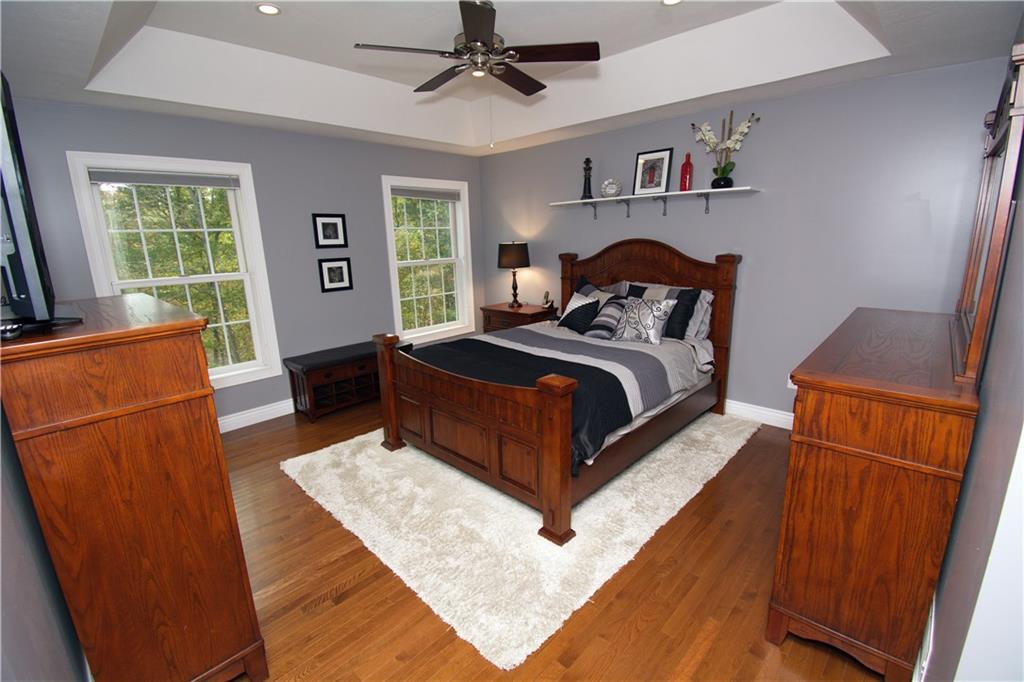 425 Rolling Hills Road Freedom, PA 15042 - Photo 10 of 25 The first floor owner's suite is highlighted with bright windows overlooking the back yard and a tray ceiling.