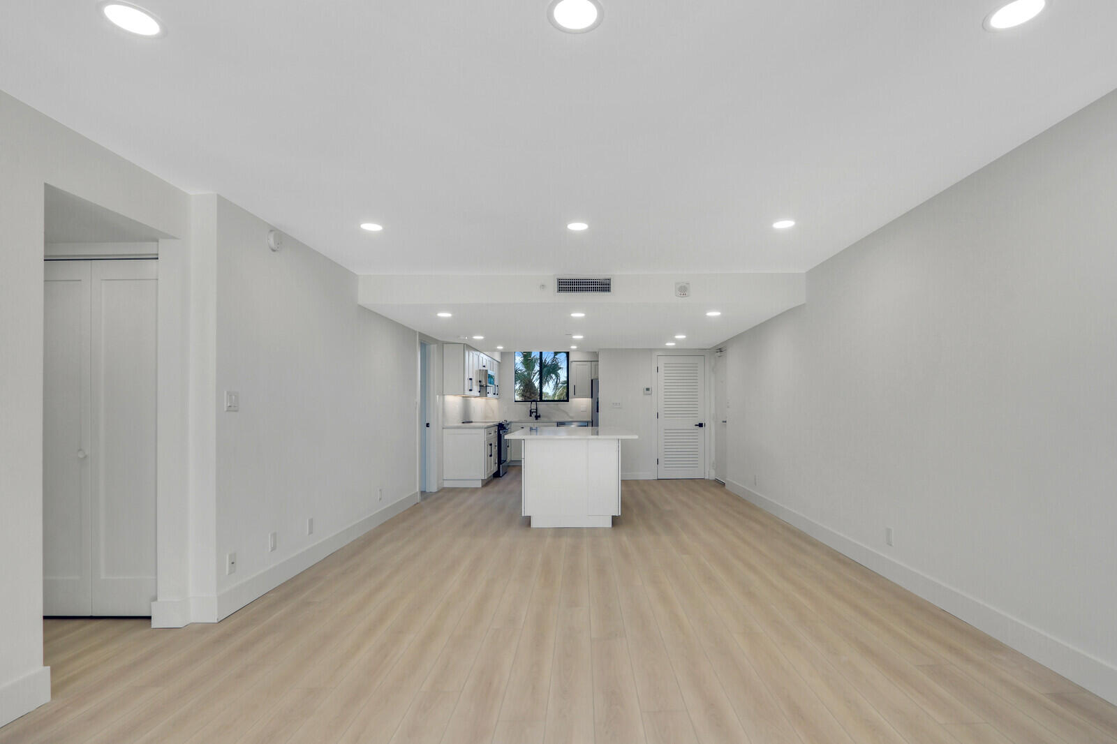 200 Ocean Trail Way, Unit T1 Jupiter, FL 33477 - Photo 14 of 39 a view of a kitchen with a refrigerator and a window