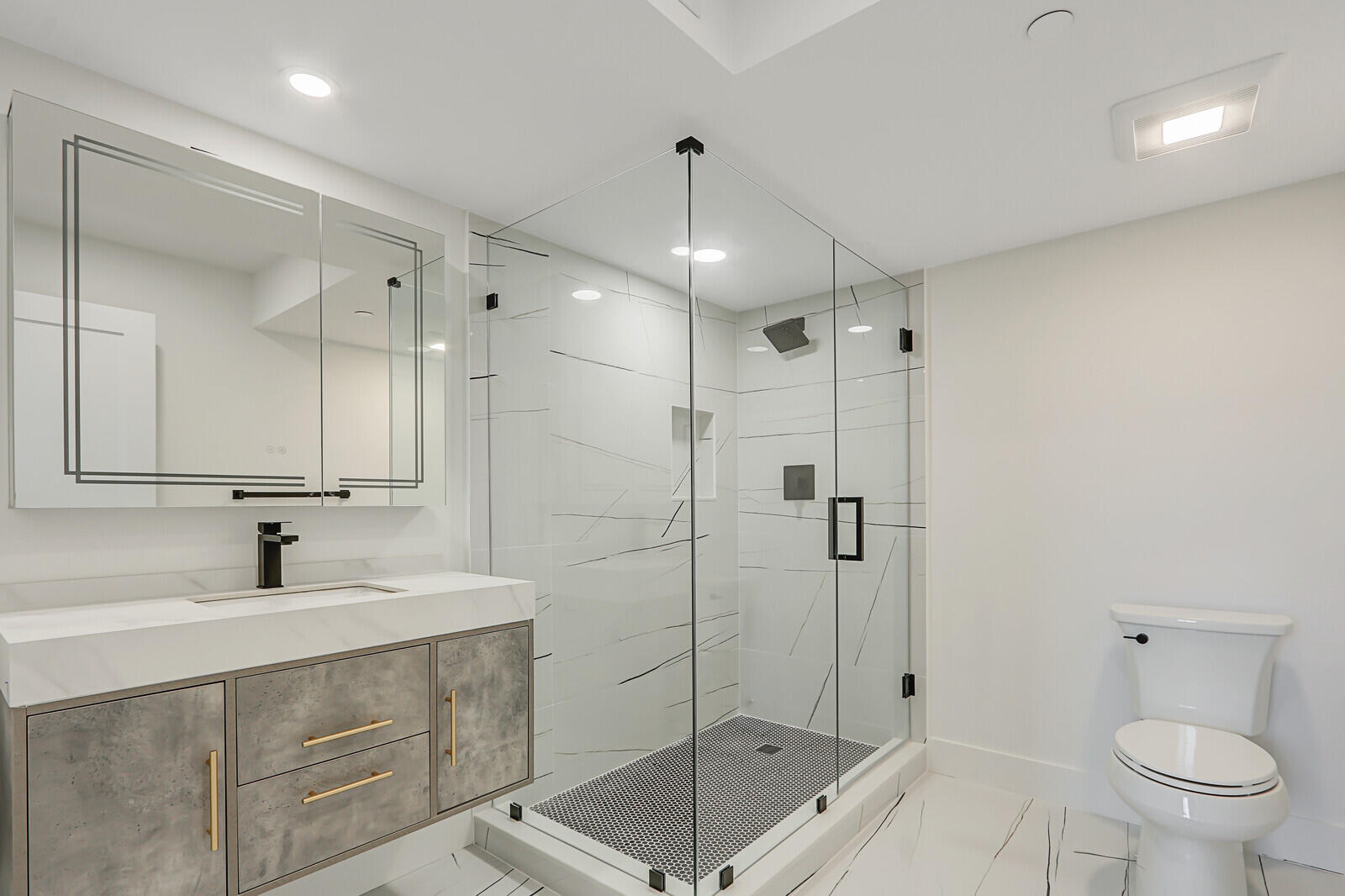 200 Ocean Trail Way, Unit T1 Jupiter, FL 33477 - Photo 29 of 39 a bathroom with a shower sink mirror and toilet