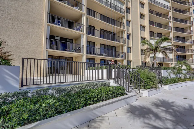 a view of a brick building next to a yard