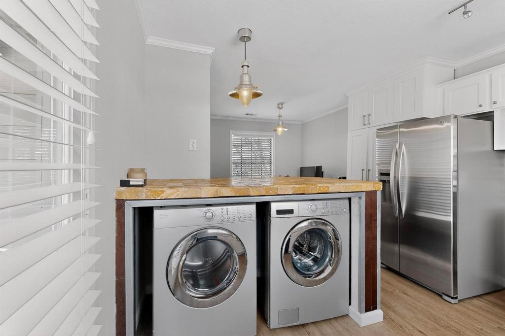 5335 Bent Tree Forest Drive, Unit 237 Dallas, TX 75248 - Photo 12 of 33 a utility room with dryer and washer